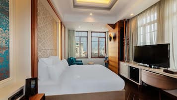 Suíte júnior, 1 cama King | Frigobar, cofres nos quartos, escrivaninha