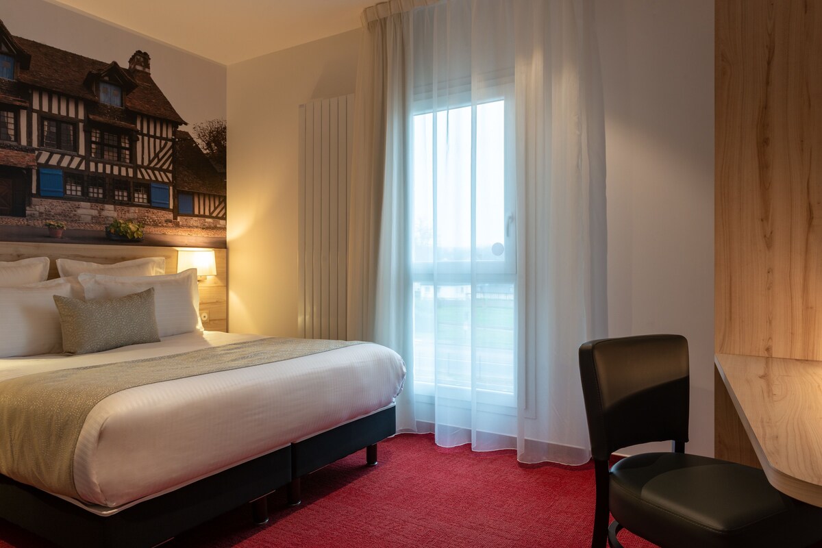 Premium bedding, pillowtop beds, desk, blackout drapes