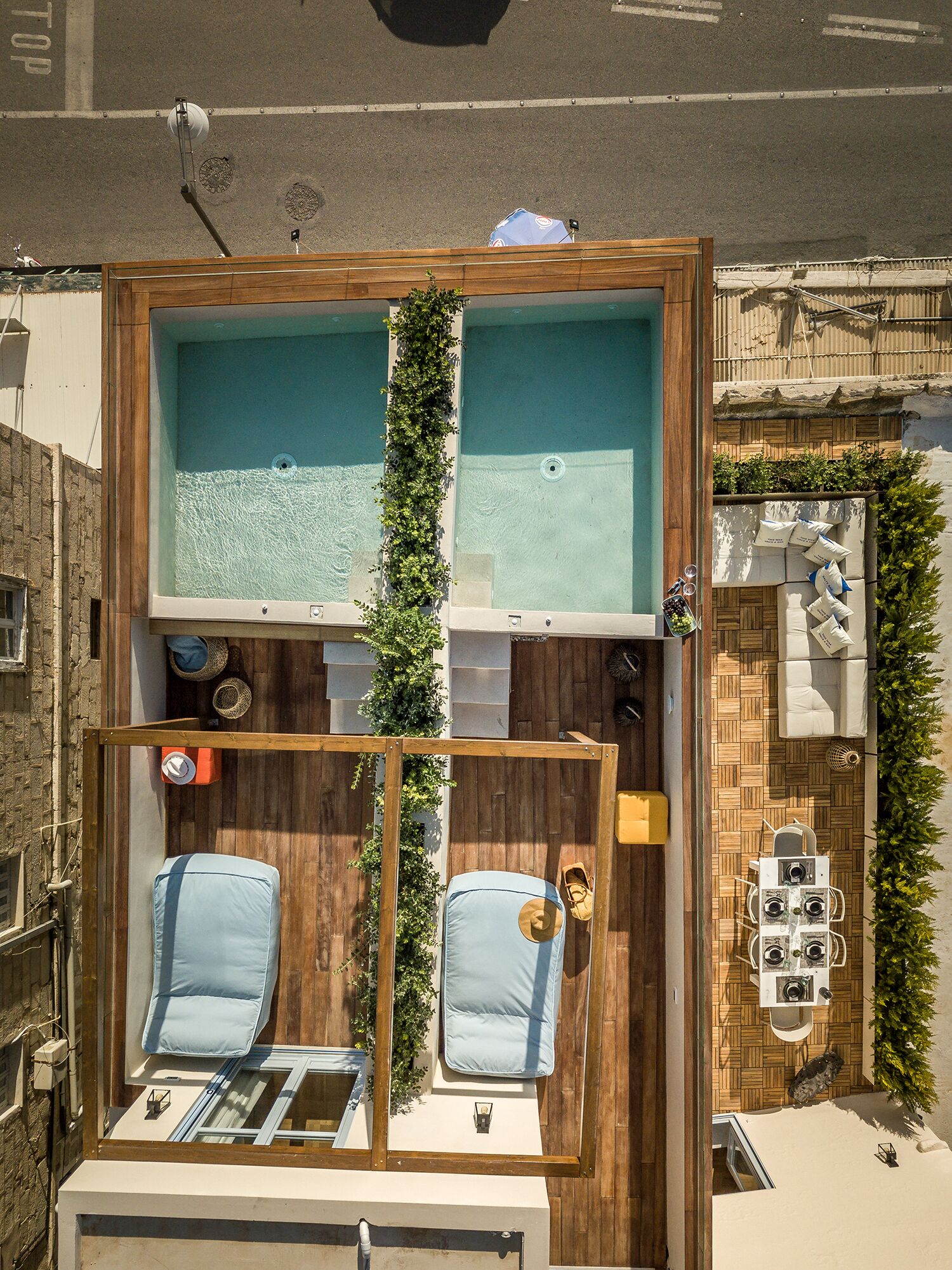 A compact, modern apartment with a small balcony, a wooden interior, and a small pool area.