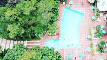 Outdoor pool, open 8:30 AM to 6:00 PM, pool umbrellas