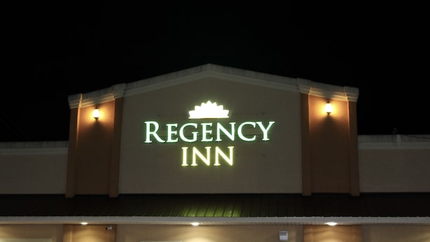 The exterior of a building with a sign that reads "REGENCY INN". - Regency Inn (Rolla)