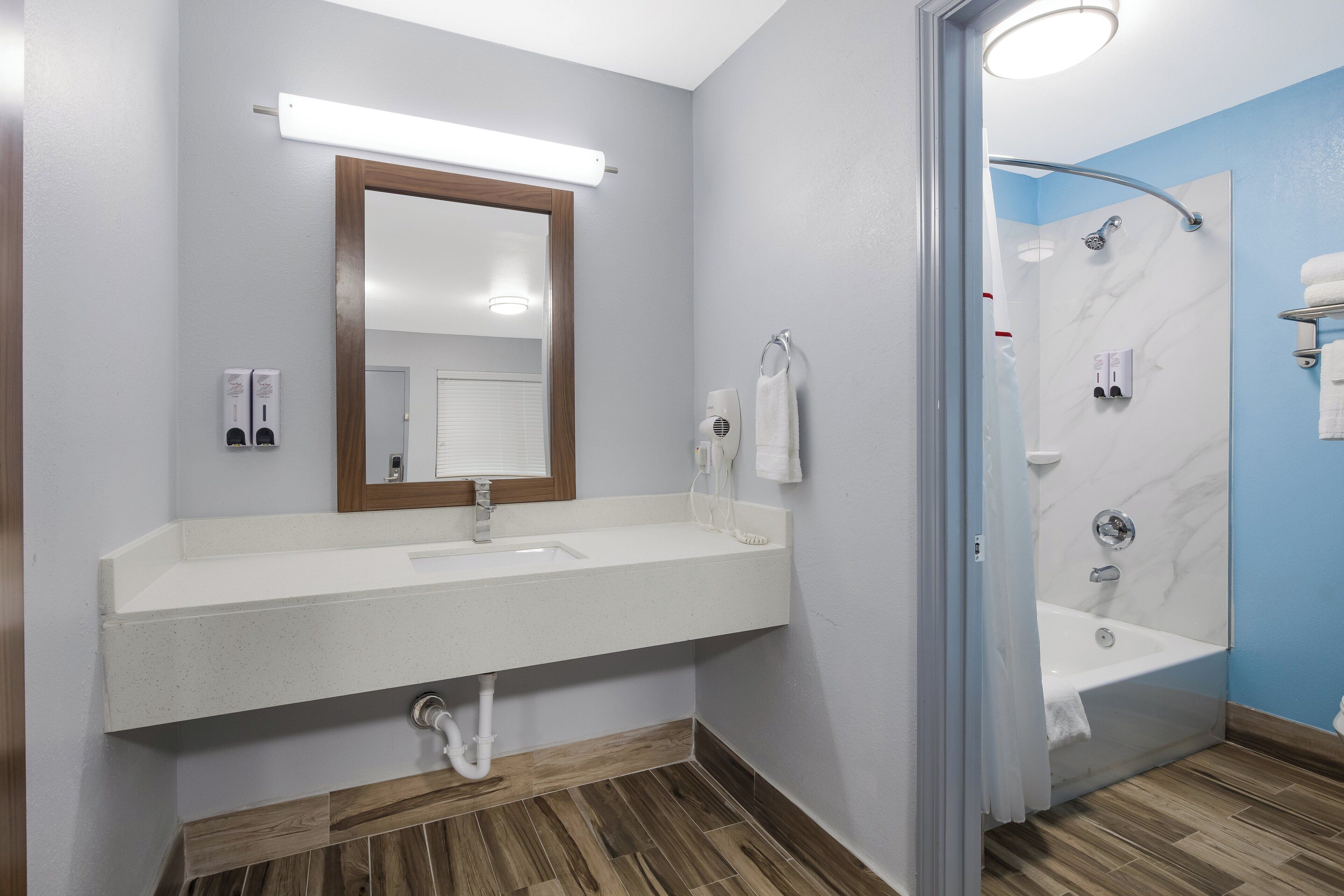 Studio, Non Smoking (1 King Bed and 2 Double Beds) | Bathroom | Combined shower/bathtub, hair dryer, towels