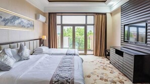 A hotel room with two beds, a TV, a large window with curtains, and a balcony. - Xihai Ecological Garden Vacation Hotel Liu’an (Lu'an)