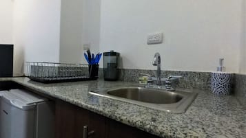 Apartment, Multiple Beds, Non Smoking | Private kitchen | Fridge, microwave, stovetop, coffee/tea maker