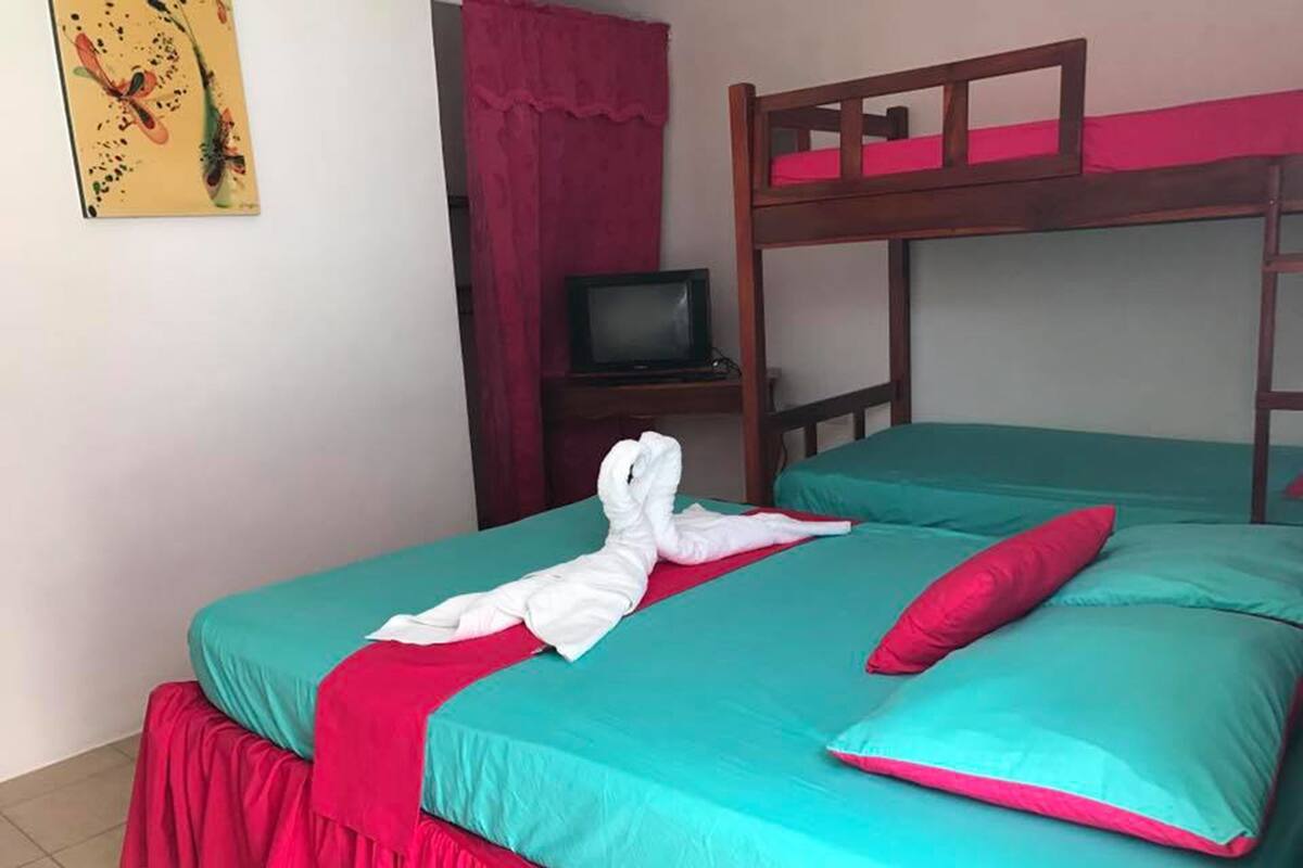 Triple Room, Multiple Beds, Non Smoking | 4 bedrooms, blackout drapes, WiFi (free), bed sheets