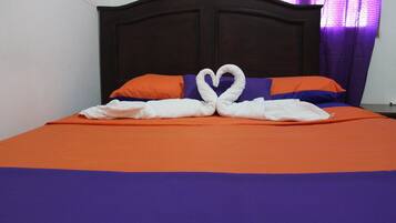 Comfort Room, 1 Queen Bed, Non Smoking, Courtyard View | 4 bedrooms, blackout drapes, free WiFi, bed sheets