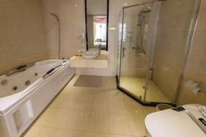 A modern bathroom with a bathtub, a glass-enclosed shower, and a sink. - Binfen Grand Hotel (Wuhu)