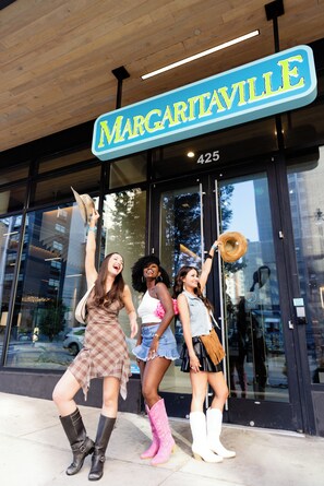 A storefront with a sign reading "MARGARITAVILLE" and a number "425" above the entrance. - Margaritaville Hotel Nashville (Nashville)