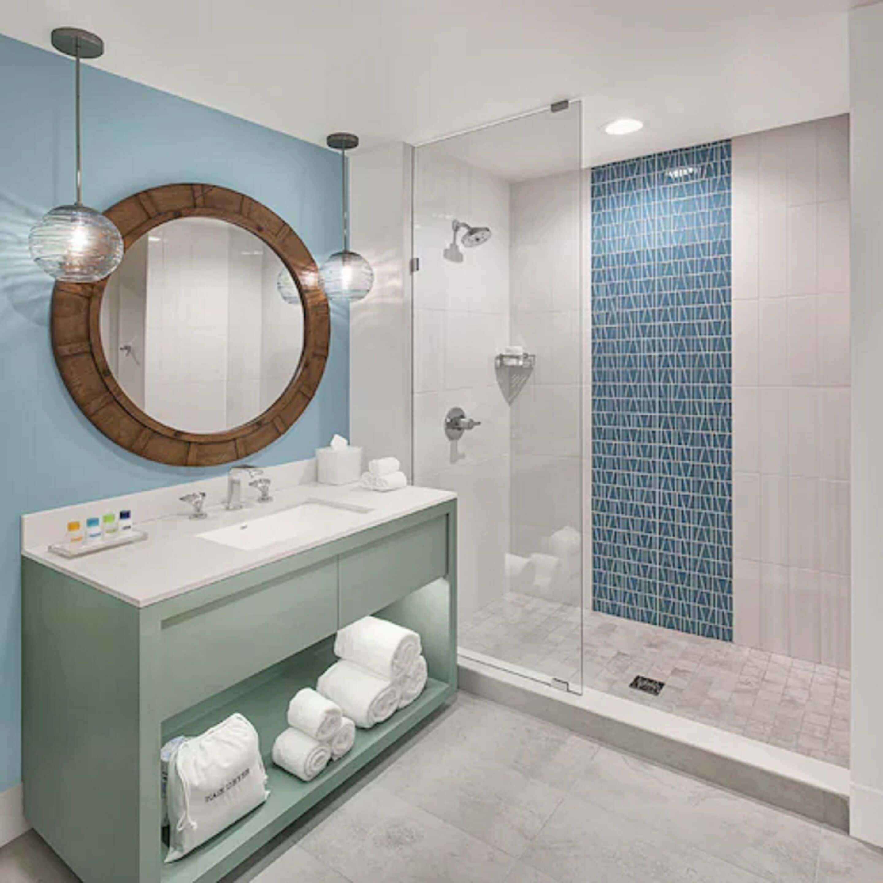 shower, designer toiletries, hair dryer, towels