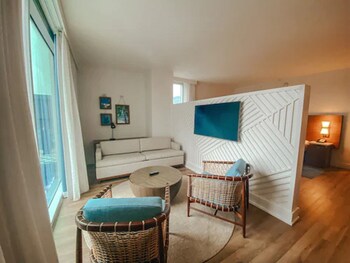 Hotel amenities such as safe, desk and work area at Margaritaville Hotel Nashville