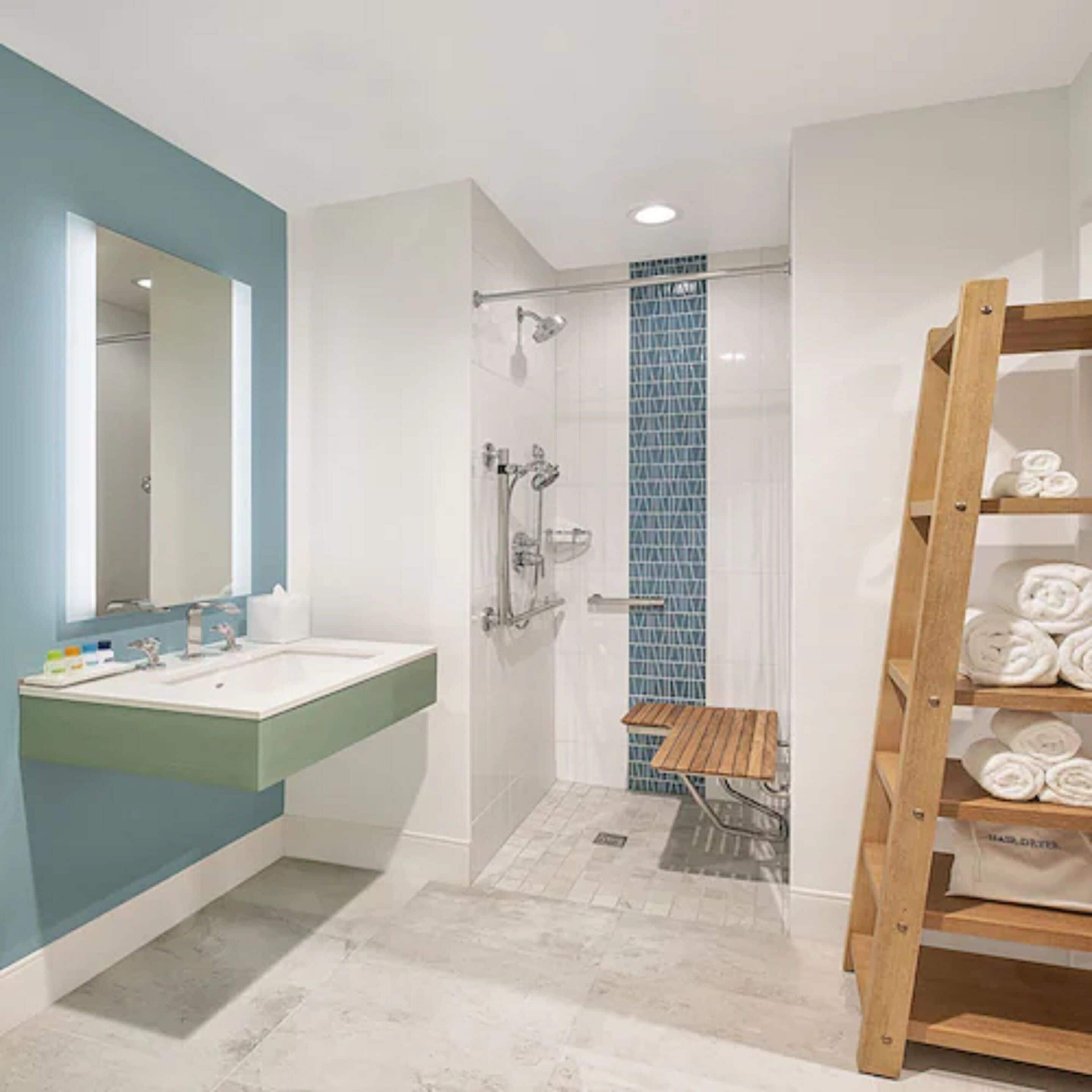 shower, designer toiletries, hair dryer, towels