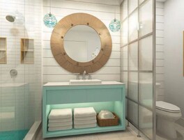 A bathroom with a round mirror, a sink, and a shelf with towels.