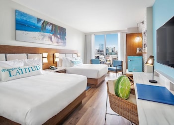 Hotel amenities such as safe, desk and work area at Margaritaville Hotel Nashville