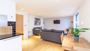 Luxury Apartment, Multiple Beds, Non Smoking, City View | Living area | 50-inch flat-screen TV with digital channels, Smart TV, Netflix