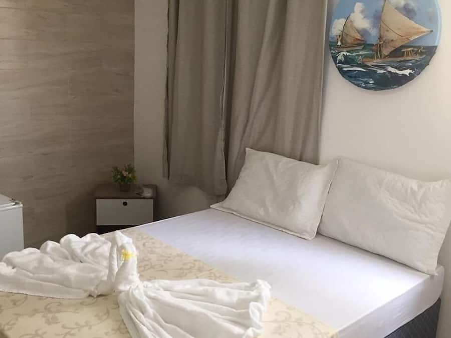 Hypo-allergenic bedding, minibar, blackout drapes, iron/ironing board