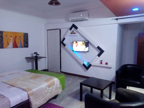 Minibar, desk, blackout curtains, iron/ironing board