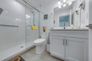 Shower, hydromassage showerhead, eco-friendly toiletries, hair dryer