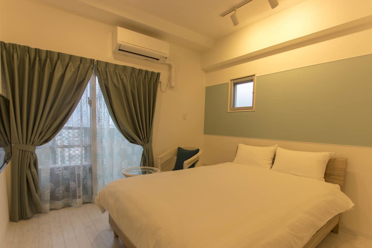 Double Room, Partial Ocean View | Blackout drapes, free WiFi, bed sheets
