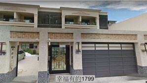 A two-story house with a garage, a balcony, and a gated entrance. - Happiness 1799 (Hualien City)