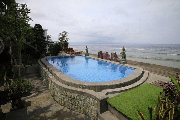 Outdoor pool, open 8:00 AM to 8:00 PM, pool umbrellas, pool loungers