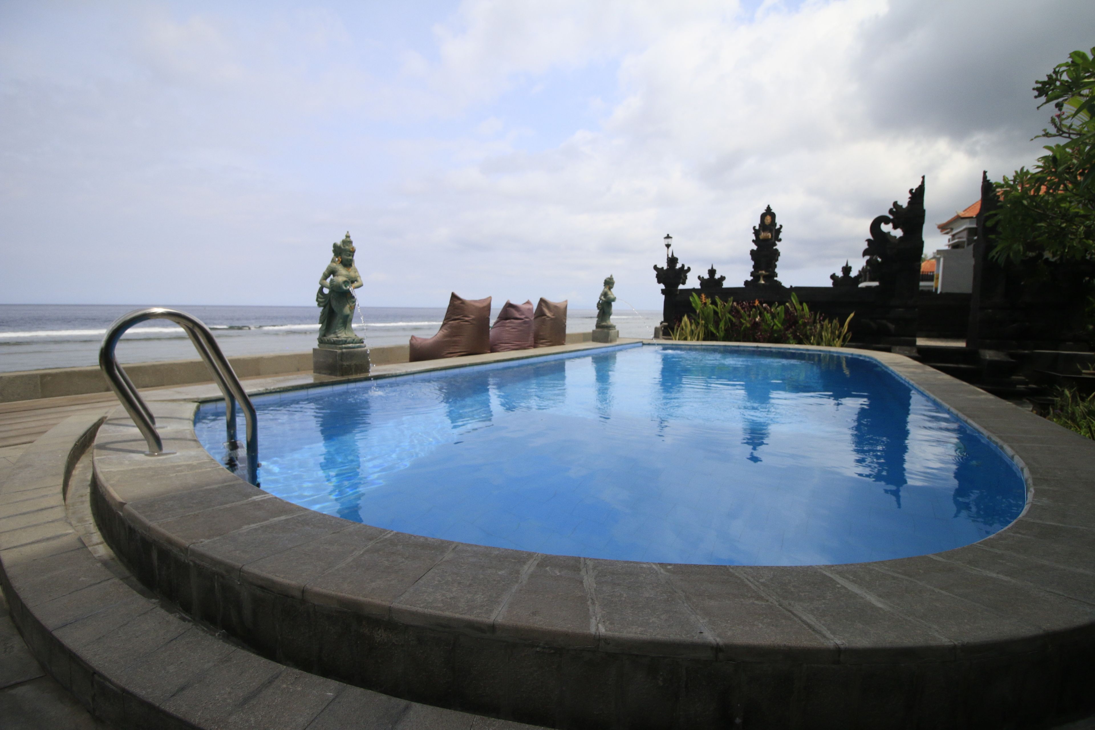 outdoor pool, open 8:00 am to 8:00 pm, pool umbrellas, pool loungers