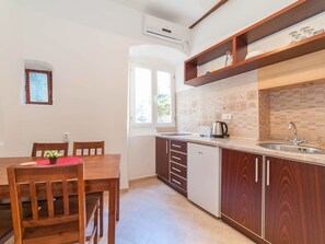 Standard Apartment, City View | Private kitchenette | Fridge, microwave, stovetop, electric kettle - Kaleta Apartments (Kotor)