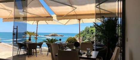 Rooftop bar, beach views, open daily
