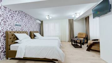 Premium bedding, down comforters, minibar, desk