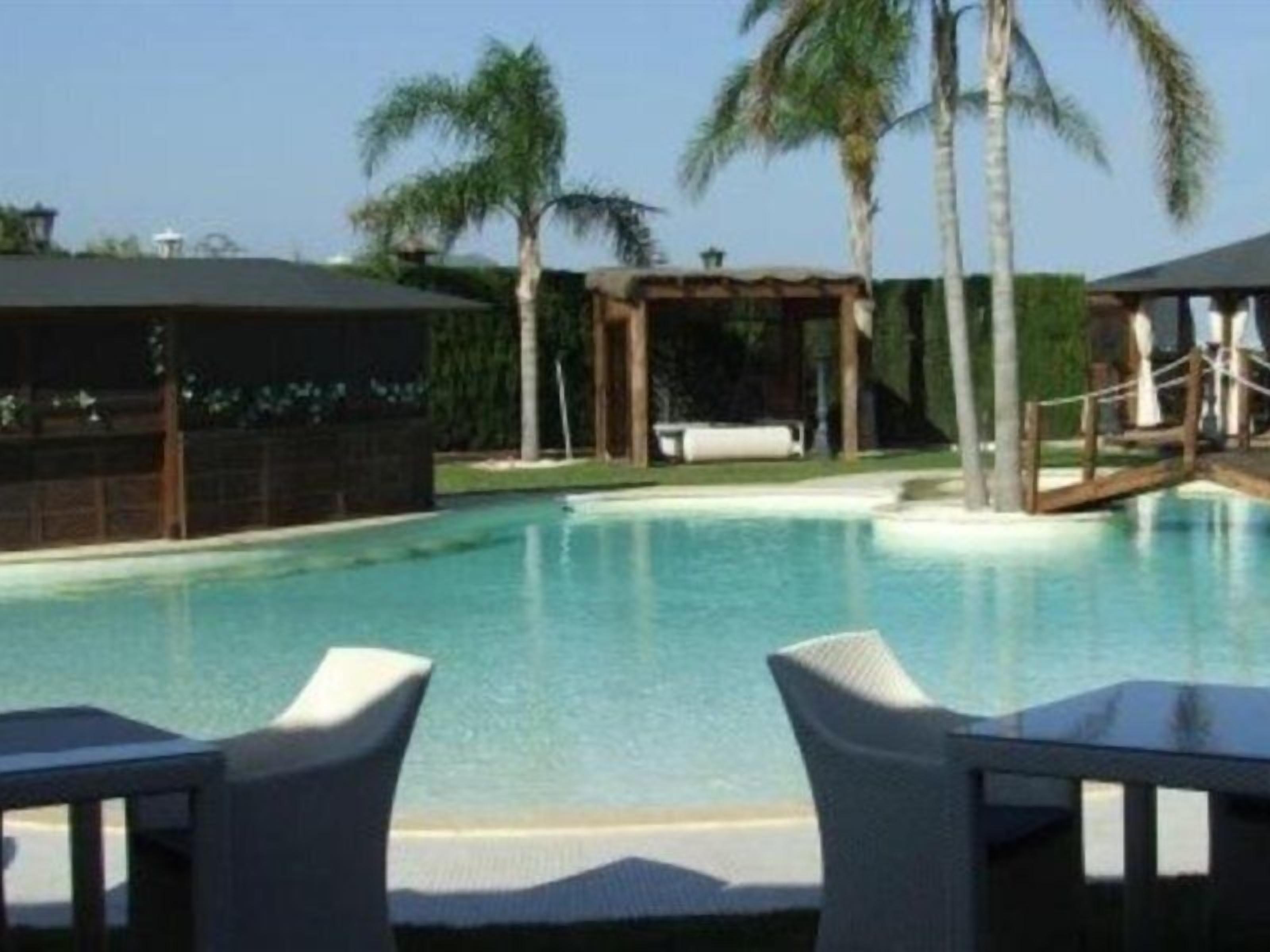 Outdoor pool, open 9:30 AM to 9:00 PM, pool umbrellas, pool loungers