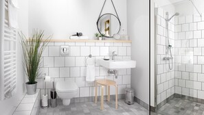 A modern bathroom with a toilet, sink, and shower. There is a potted plant, a towel rack, and a small stool. - Hotel Au Petit Pont (La Wantzenau)