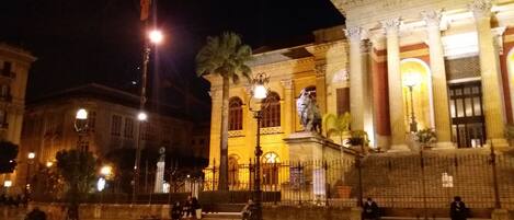 A historic building with classical architecture, including columns and arches.