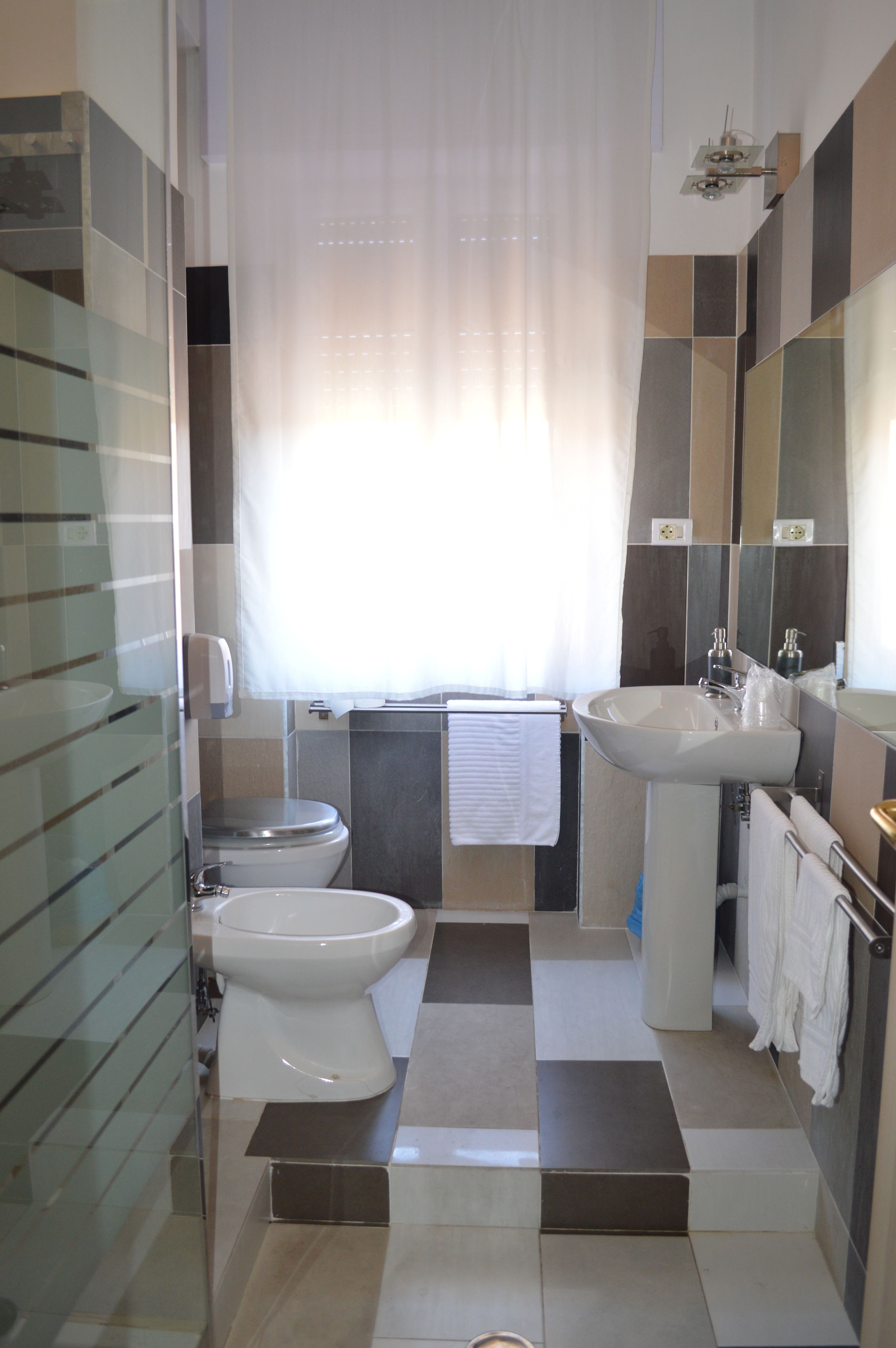 Comfort Quadruple Room, Multiple Beds, Non Smoking, City View | Bathroom | Shower, rainfall showerhead, hair dryer, towels