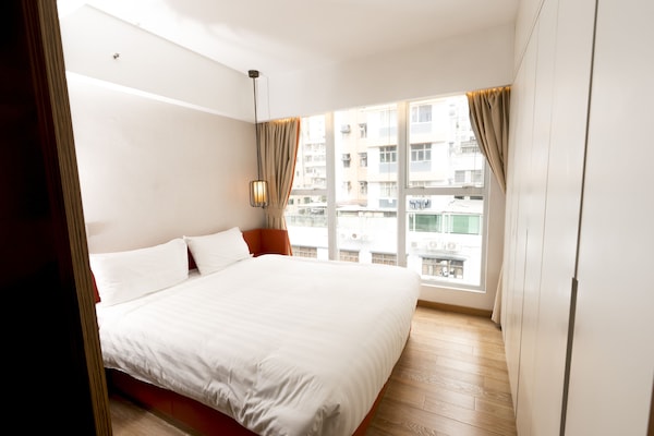 Suite, 1 slaapkamer | 1 slaapkamer, een kluis op de kamer, een strijkplank/strijkijzer