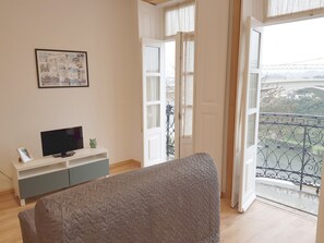 Panoramic Studio, Balcony, River View (2nd Floor) | Living area | 24-inch LCD TV with cable channels, TV