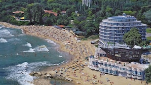 A beach resort with multiple buildings, including a large circular structure with balconies and a ship-shaped building. - Sirius Beach Hotel & SPA (Varna)
