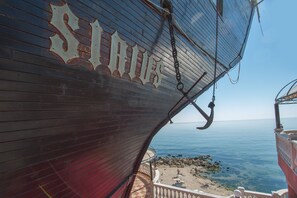 A large ship's bow with the name "SITGES" and a view of the sea. - Sirius Beach Hotel & SPA (Varna)