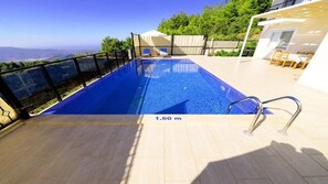 Outdoor pool, pool umbrellas, pool loungers