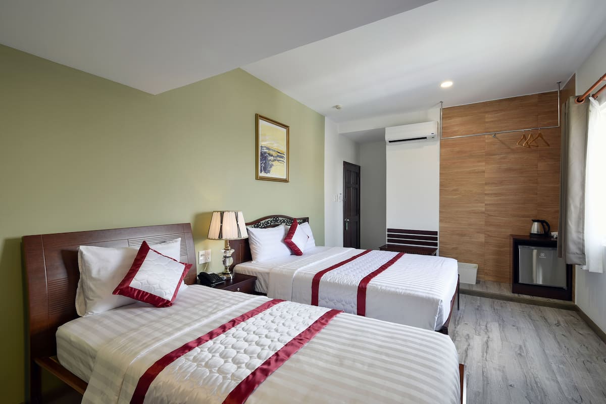 Deluxe Twin kamer | Een minibar, een bureau, gratis wifi, beddengoed