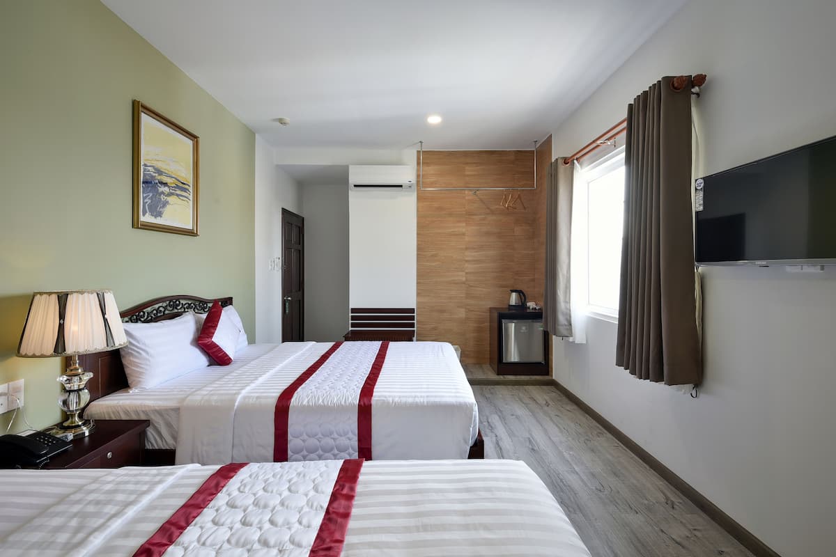 Familie suite | Een minibar, een bureau, gratis wifi, beddengoed