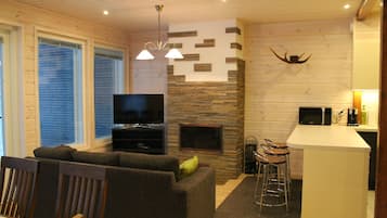 Deluxe Apartment, 4 Bedrooms, Sauna | Living room | Flat-screen TV, fireplace, ping pong, heated floors