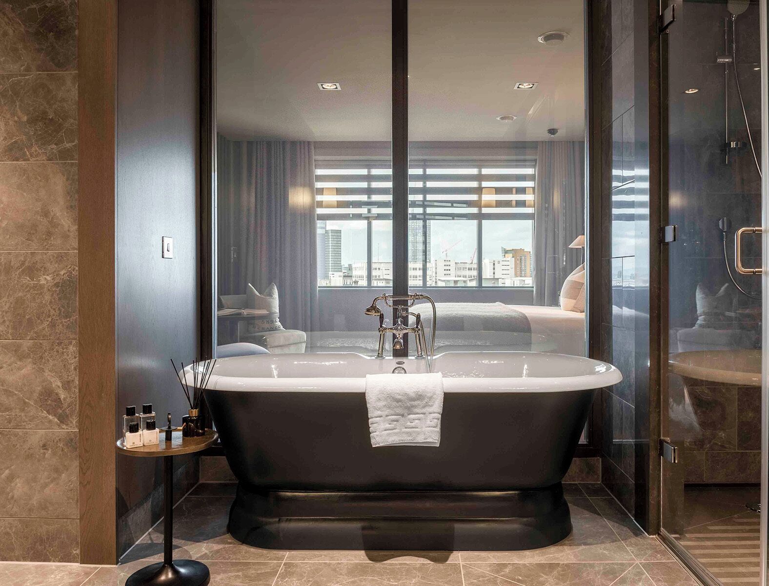 deluxe suite | bathroom | slippers, towels