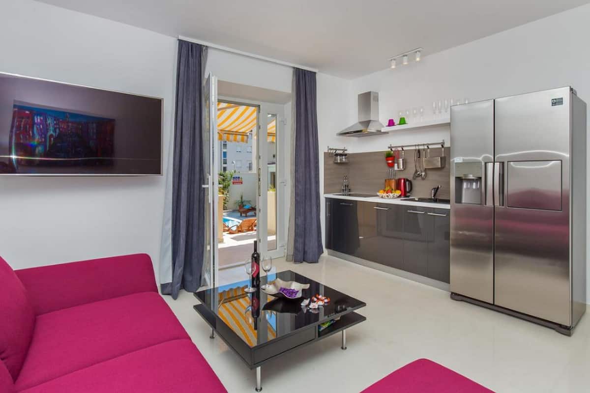 Superior Apartment, 2 Bedrooms, Pool View | Living area | 35-inch flat-screen TV with satellite channels, TV