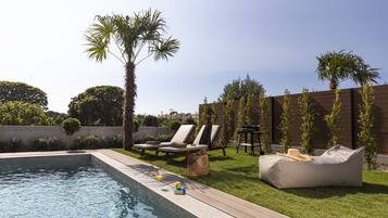 Outdoor pool, pool umbrellas, pool loungers