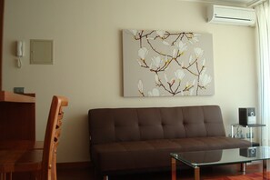 Apartment, Multiple Beds, Non Smoking | Living area | Flat-screen TV, MP3 dock - Travel Place Lyon (Santiago)