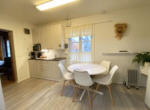 Traditional Apartment, Multiple Beds, Non Smoking, Courtyard View | Dining room - LAURI Historical Log House Manor (Rovaniemi)