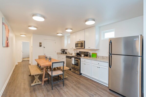 Fridge, microwave, toaster oven, cookware/dishes/utensils