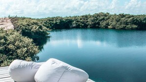 A wooden deck with two white cushions. - Cormoran Boutique Hotel & Cenote Tulum (Tulum)