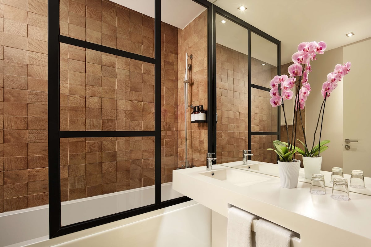 eco-friendly toiletries, hair dryer, bathrobes, towels