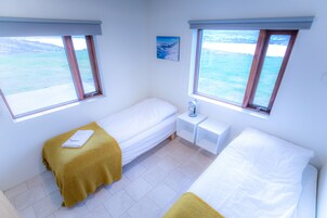Apartment, 2 Bedrooms, Sea View (01) | Blackout drapes, iron/ironing board, free cribs/infant beds, free WiFi