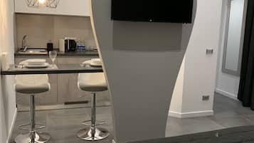 Apartamento conforto | Área de estar | TV de tela plana
